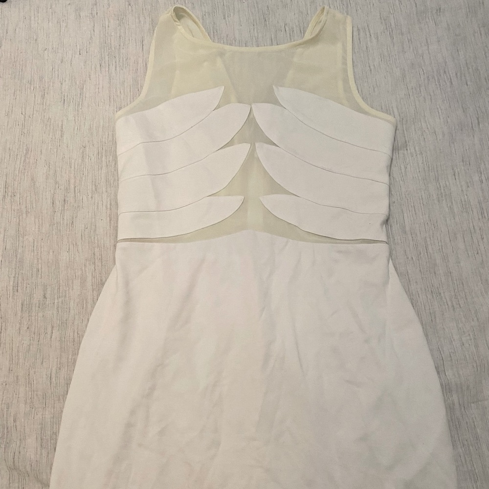 White Bebe dress very comfortable and stretchy! Worn once.